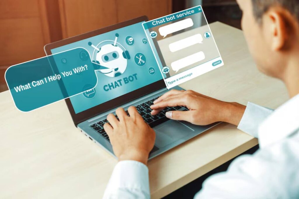 Man using laptop with a chatbot interface on screen asking What can I help you with?