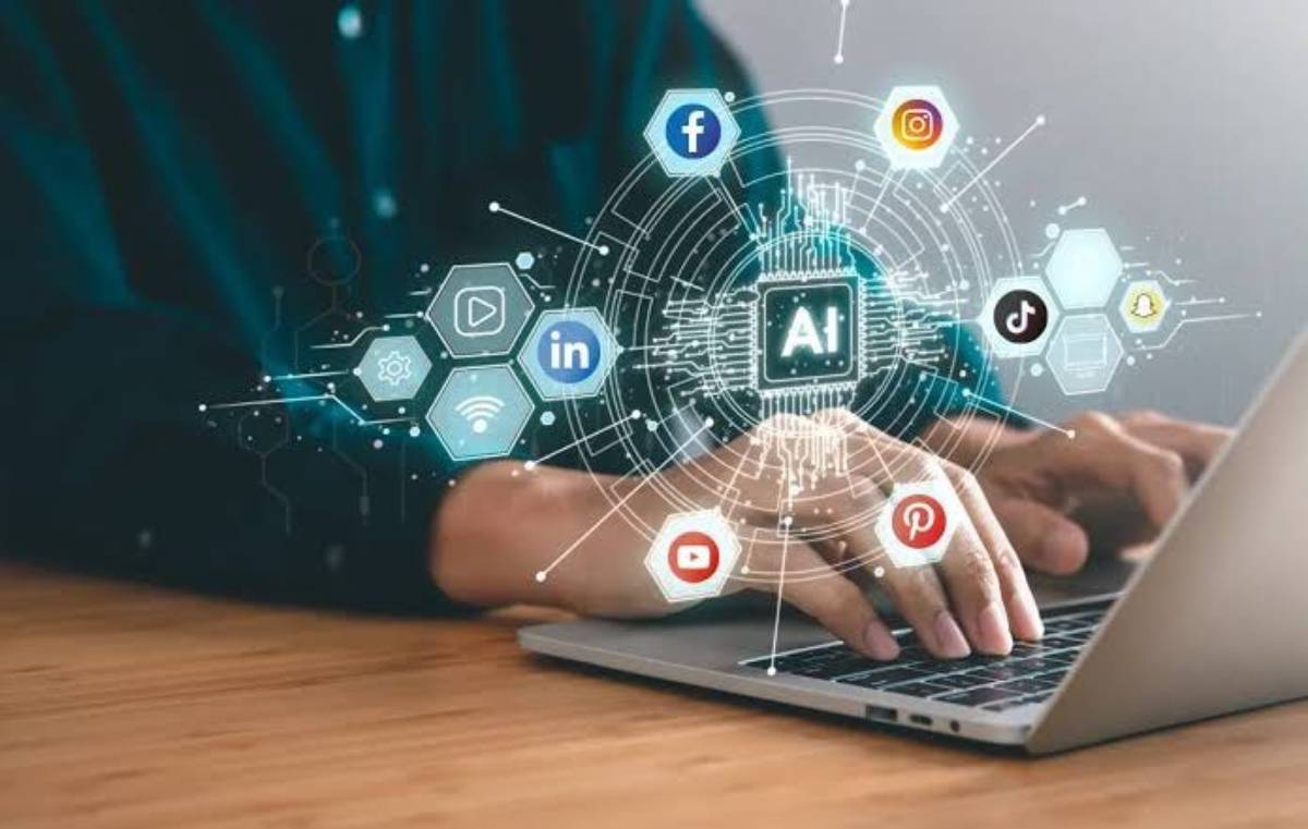 Person using a laptop with futuristic social media and AI icons floating above the screen.