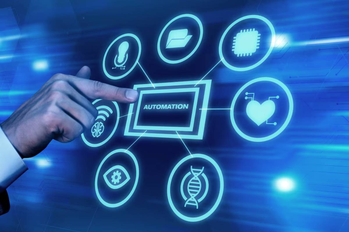 A person interacting with a futuristic automation control interface displaying various technology icons in blue light.