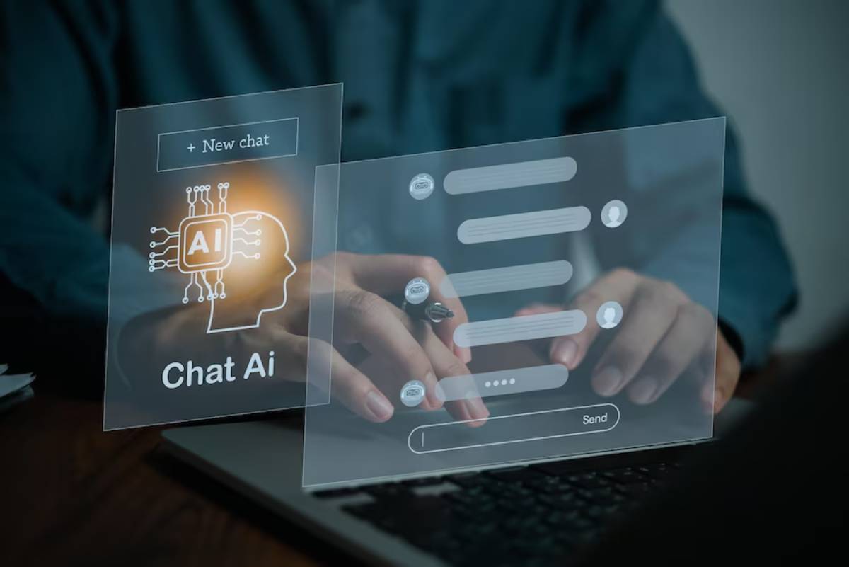 Person using a futuristic AI chat interface on a transparent digital screen over a laptop.