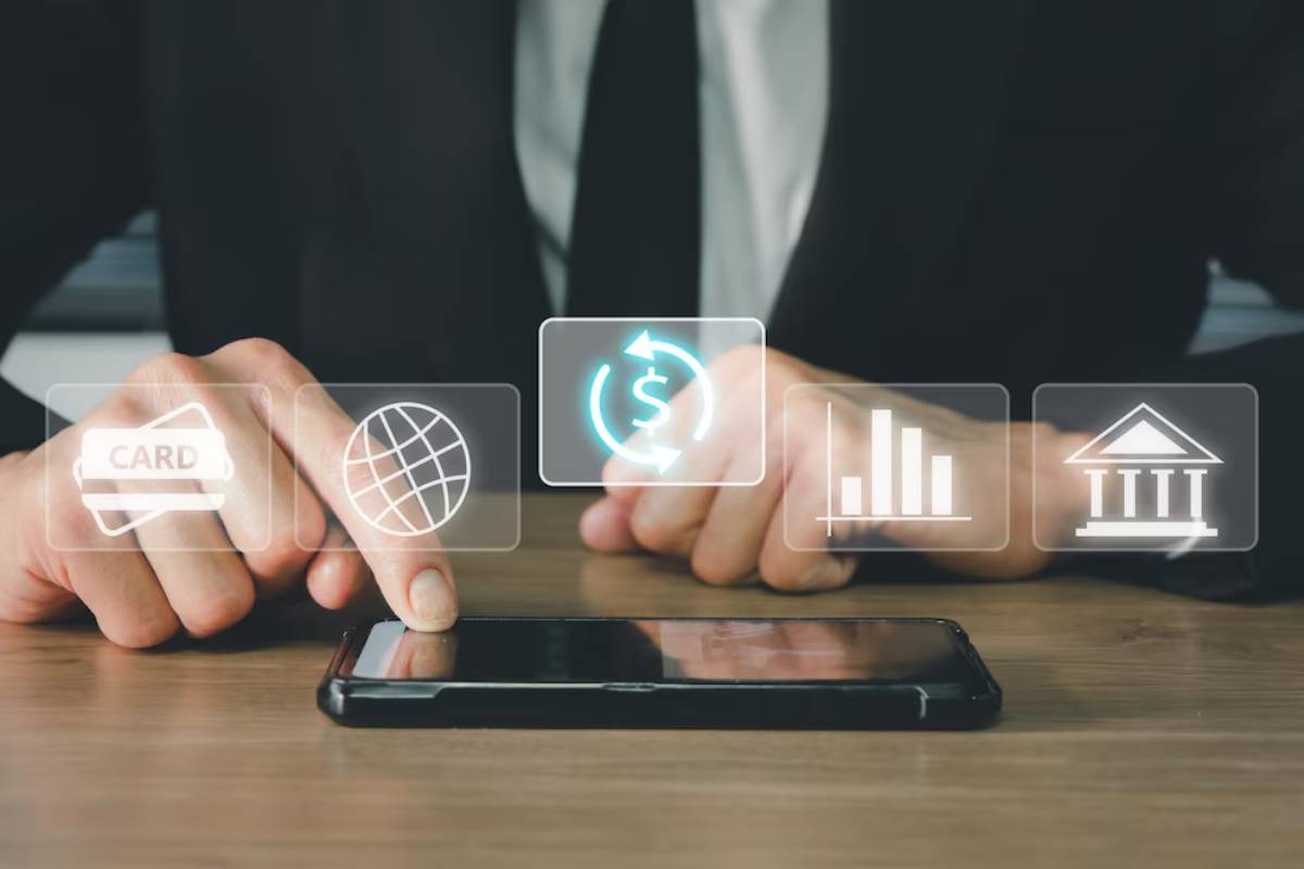 Businessman using smartphone with digital icons for banking and online transactions floating above.
