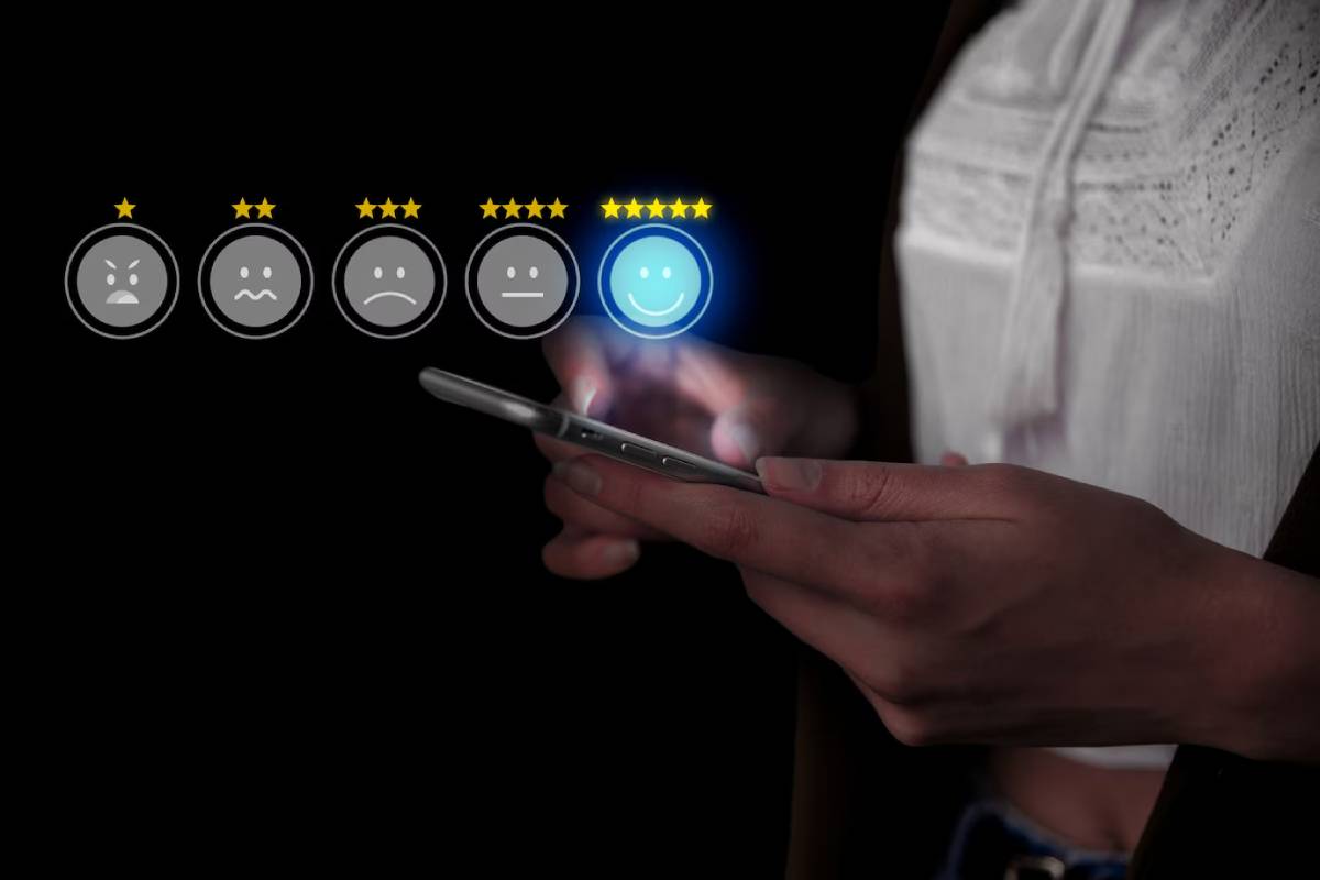 Person using smartphone with glowing five-star customer satisfaction rating displayed above, highlighting the best choice.