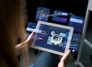 Three professionals analyze data charts on laptops during a business meeting.