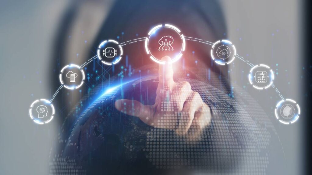 A person interacting with futuristic holographic interface displaying various technology icons over a digital globe.
