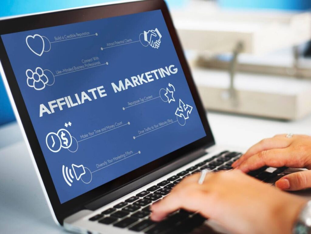Person typing on a laptop displaying Affiliate Marketing with related icons and strategies.