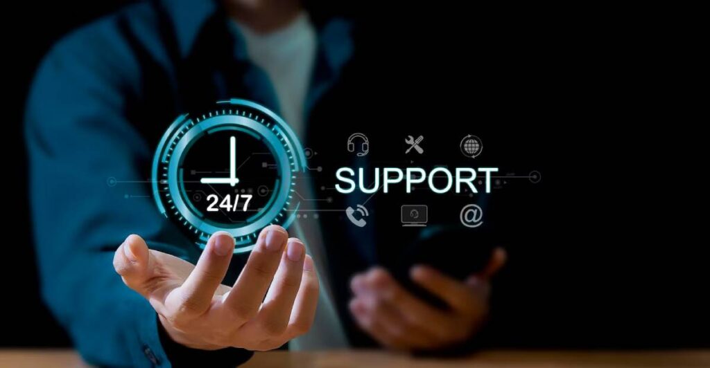 Person in a suit interacting with a holographic "24/7 Support" display, illustrating customer service availability.
