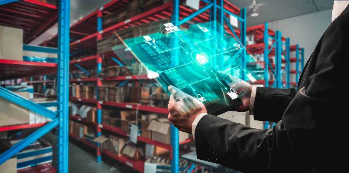 Person using a futuristic holographic device to manage inventory in a warehouse.